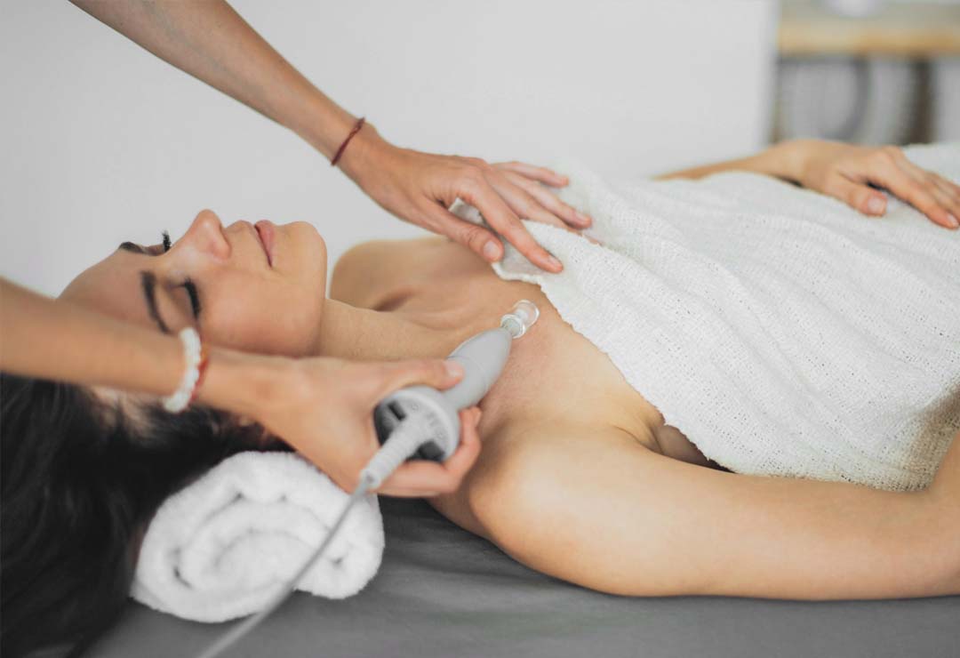 Woman receiving laser treatment at a cosmetic clinic