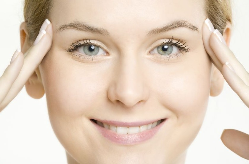 Smiling woman with clear skin from chemical peels.
