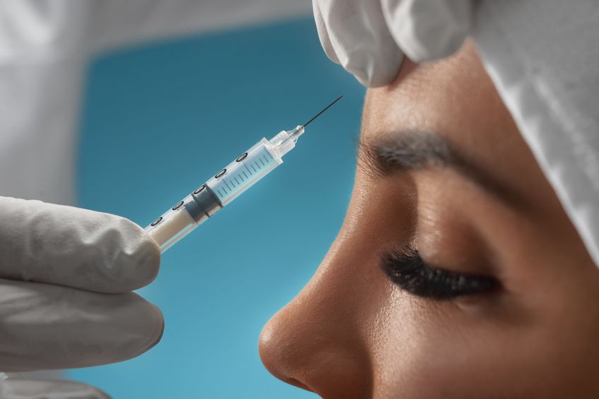 Woman having a cosmetic Botox injection