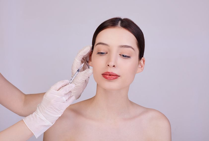Beautiful woman receiving Restylane filler